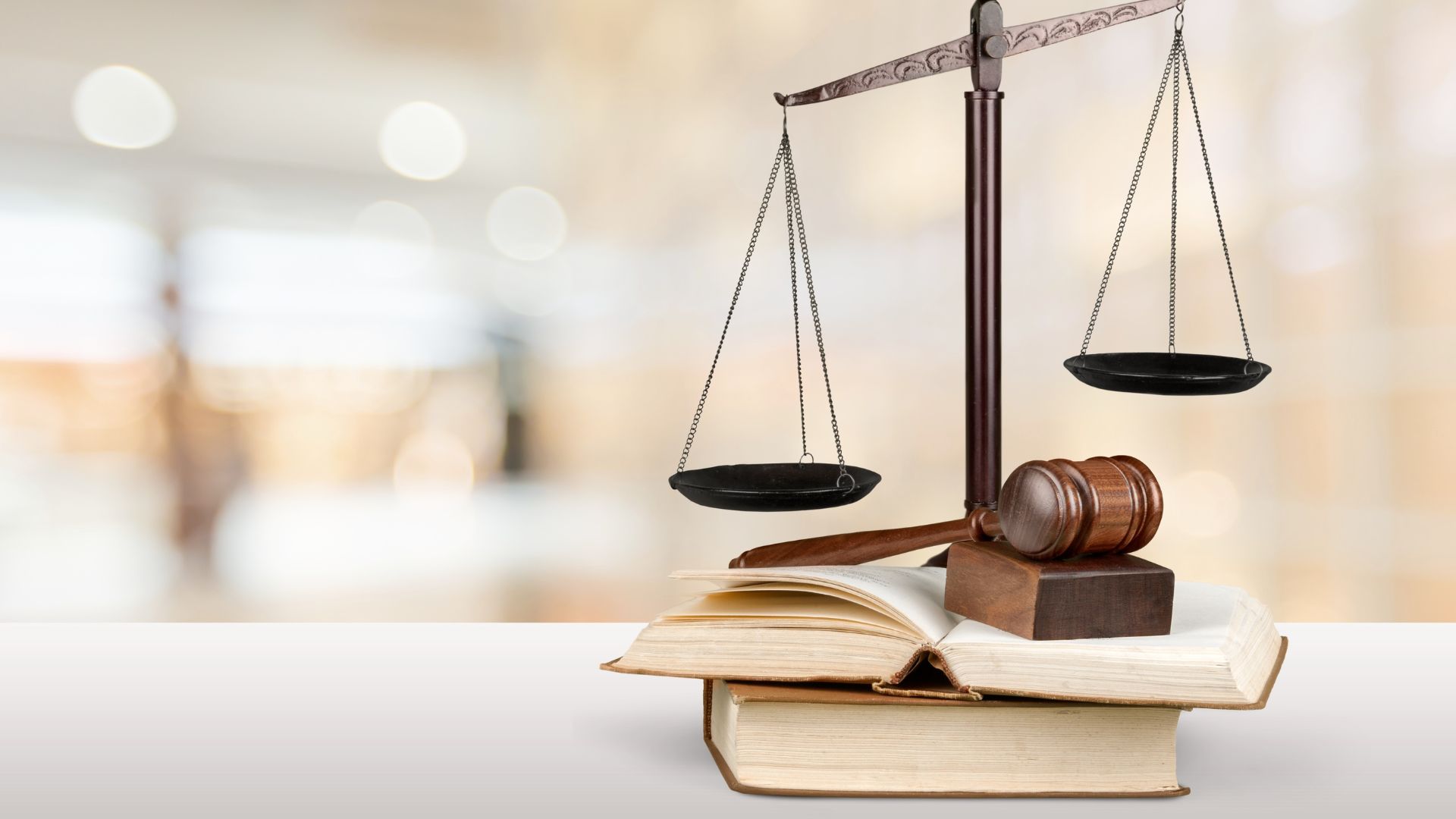 Scales of justice, a judge's gavel and law books